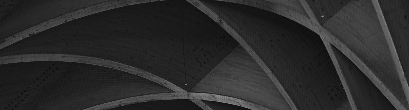 Artistic wooden architectural structure in black and white.